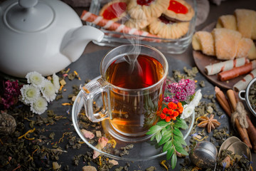 Tea hot drink on old background in composition on the table