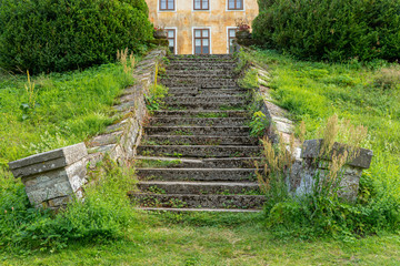 Fototapeta na wymiar Old skewd and warped stair at a rather rundown castle in Sweden