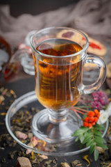 Tea hot drink on old background in composition on the table