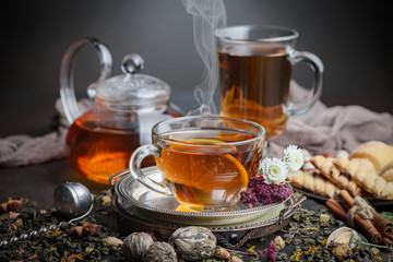 Tea hot drink on old background in composition on the table
