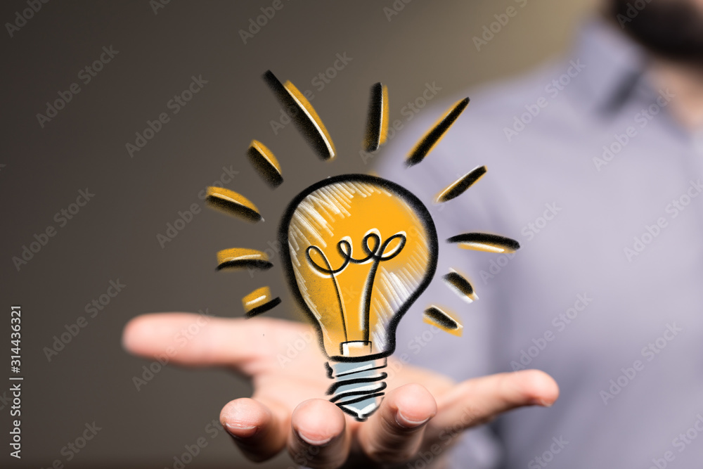 Poster idea lamp concept in hand.