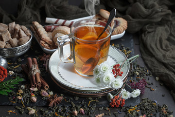 Tea hot drink on old background in composition on the table