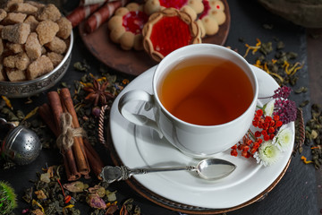 Tea hot drink on old background in composition on the table