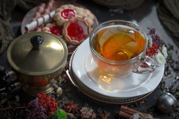 Tea hot drink on old background in composition on the table