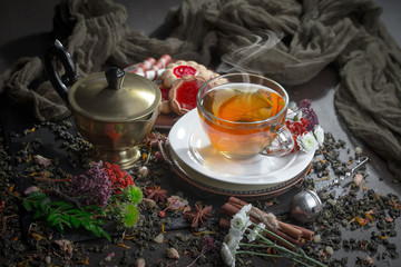 Tea hot drink on old background in composition on the table