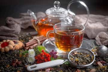Tea hot drink on old background in composition on the table