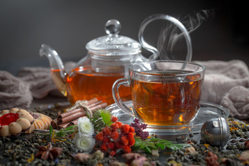 Tea hot drink on old background in composition on the table