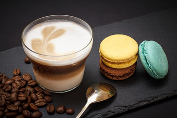 Coffee cappuccino and coffee beans on black background
