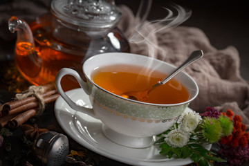 Tea hot drink on old background in composition on the table