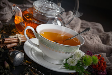Tea hot drink on old background in composition on the table