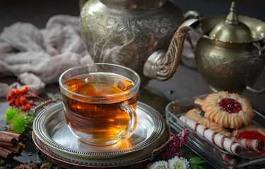 Tea in a cup on an old background