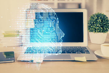Double exposure of table with computer and brain hologram. Data innovation concept.