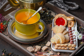 Tea hot drink on old background in composition on the table
