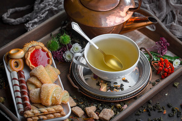 Tea hot drink on old background in composition on the table