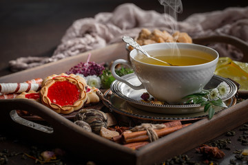 Tea hot drink on old background in composition on the table