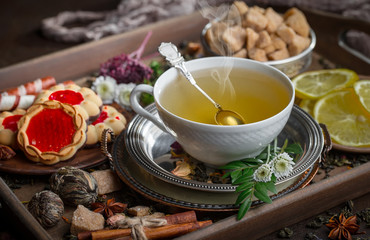 Tea in a cup on an old background