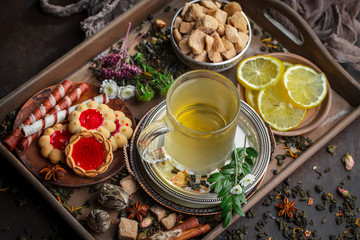 Tea hot drink on old background in composition on the table