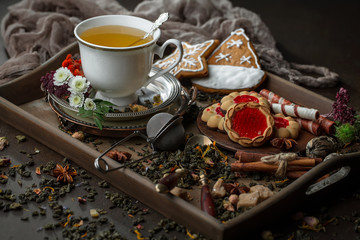 Tea hot drink on old background in composition on the table