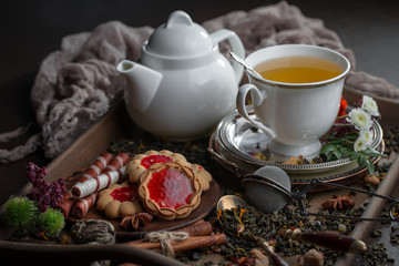 Tea hot drink on old background in composition on the table