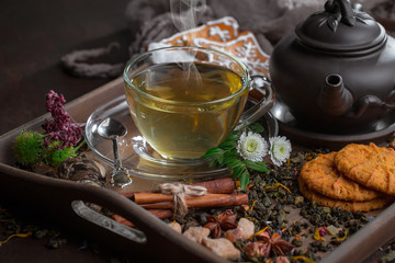 Tea hot drink on old background in composition on the table