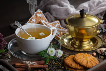 Tea hot drink on old background in composition on the table