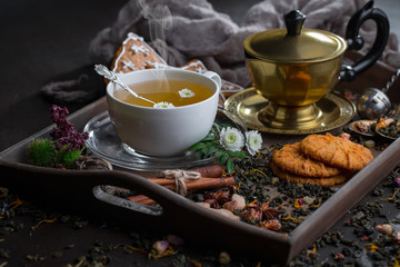 Tea hot drink on old background in composition on the table