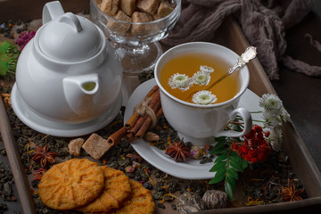 Tea hot drink on old background in composition on the table
