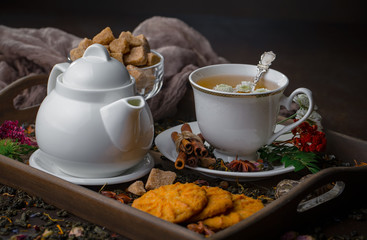 Tea hot drink on old background in composition on the table