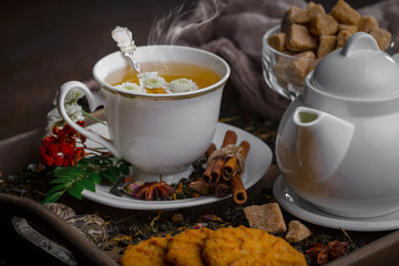 Tea in a cup on an old background