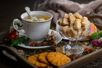 Tea hot drink on old background in composition on the table