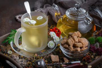 Tea hot drink on old background in composition on the table