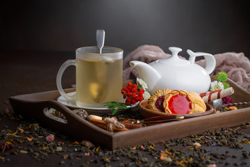 Tea hot drink on old background in composition on the table