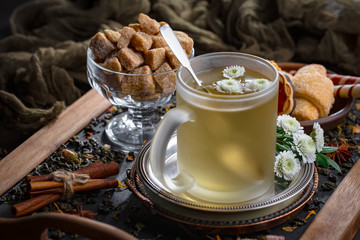 Tea hot drink on old background in composition on the table