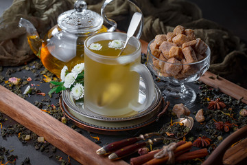 Tea hot drink on old background in composition on the table