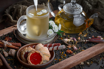 Tea hot drink on old background in composition on the table