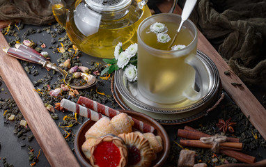 Tea hot drink on old background in composition on the table
