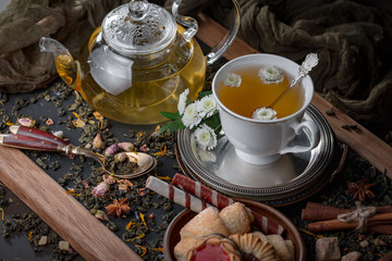 Tea hot drink on old background in composition on the table