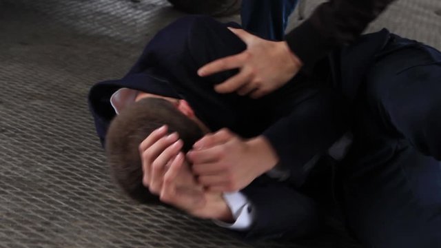 The fight on the street. Criminal. Attack. Assault on a person. Protection. Hit. The fight under the bridge. Bandits. Evil. Close-up.