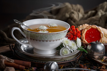 Tea in a cup on an old background