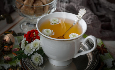 Tea hot drink on old background in composition on the table