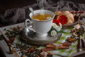 Tea hot drink on old background in composition on the table