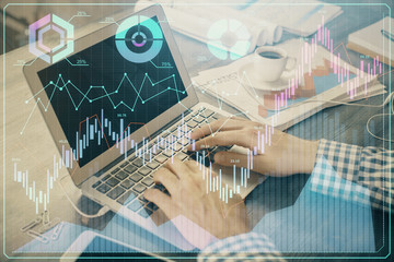 Double exposure of forex graph with man working on computer on background. Concept of market analysis.