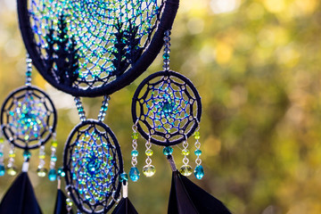 Obraz premium Handmade dream catcher with feathers threads and beads rope hanging