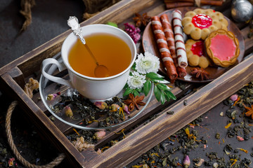 Tea in a cup on an old background