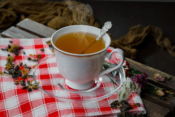 Tea in a cup on an old background
