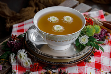 Tea hot drink on old background in composition on the table