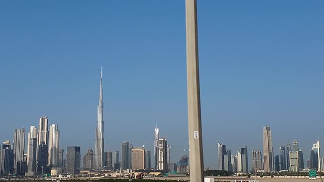 Zoom Shot of Dubai Skyline From Road on a Sunny Day