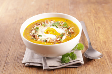 bowl of pumpkin soup with cream