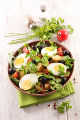 mixed vegetable salad with potato, olive, tomato and egg