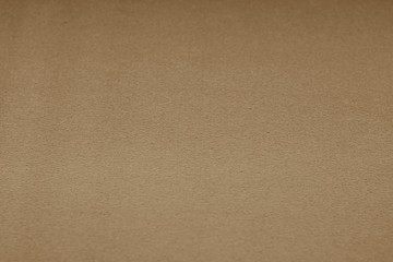 Plastic glittering texture with blur effect in brown tone.